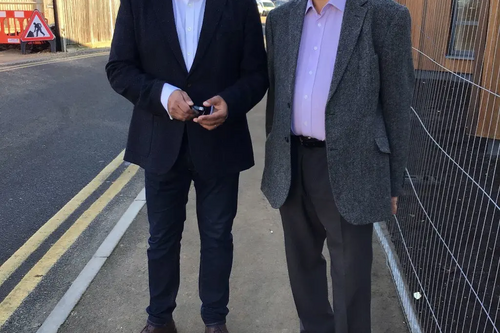 Ayub Khan and Melvin Caton outside new Stansted Community Hub building