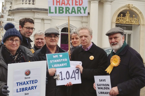 Uttlesford Lib Dem campaigners hand over their local petition signatures to County Councillor Stephen Robinson. of the official opposition group on Essex County Council.